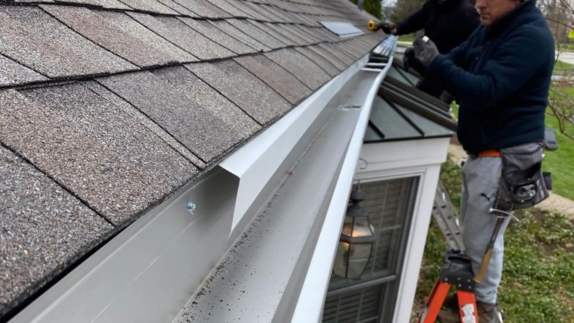Gutter repair team in action